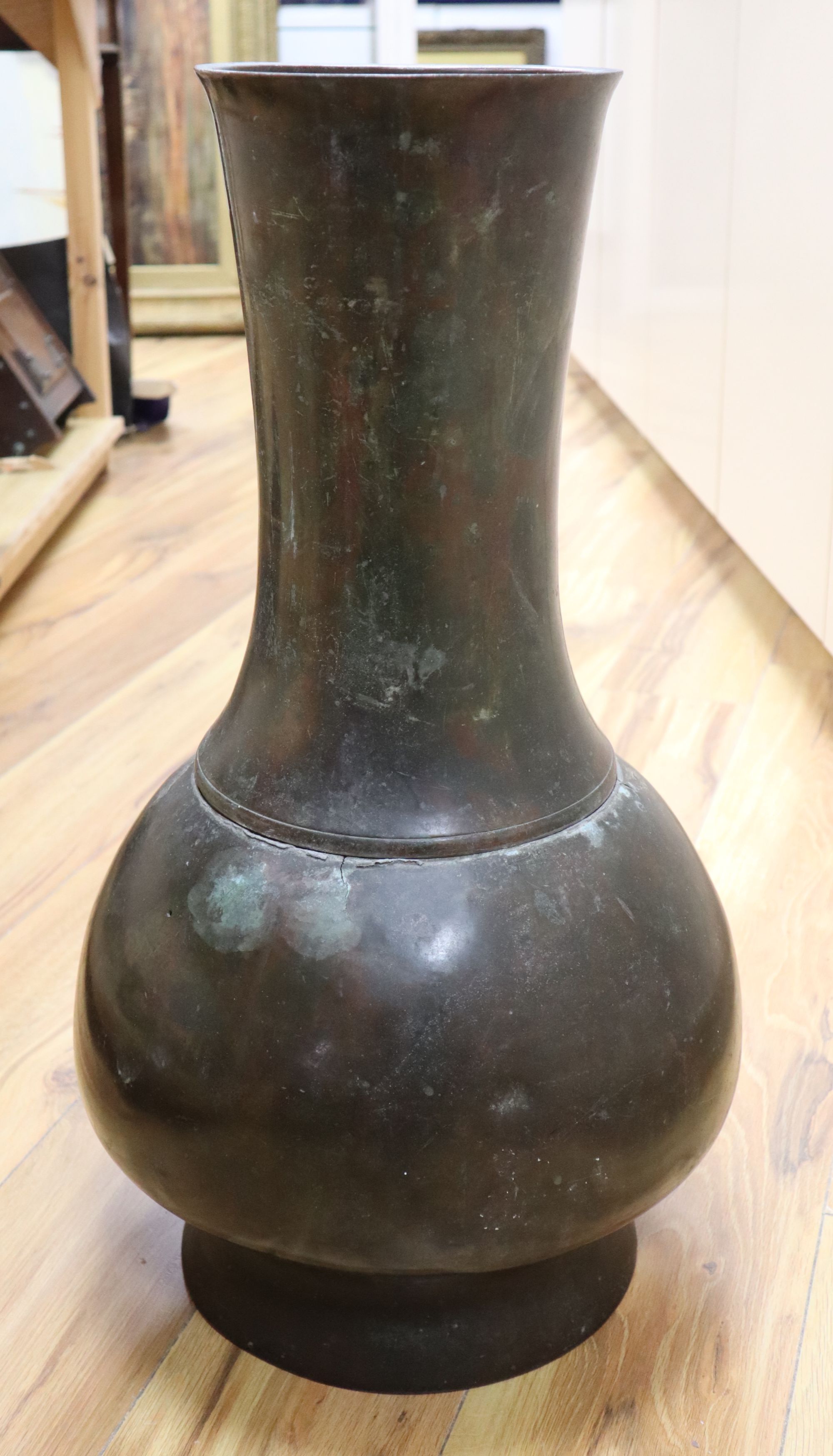 A 17th/18th century Chinese bronze baluster vase, height 65cm (holed)